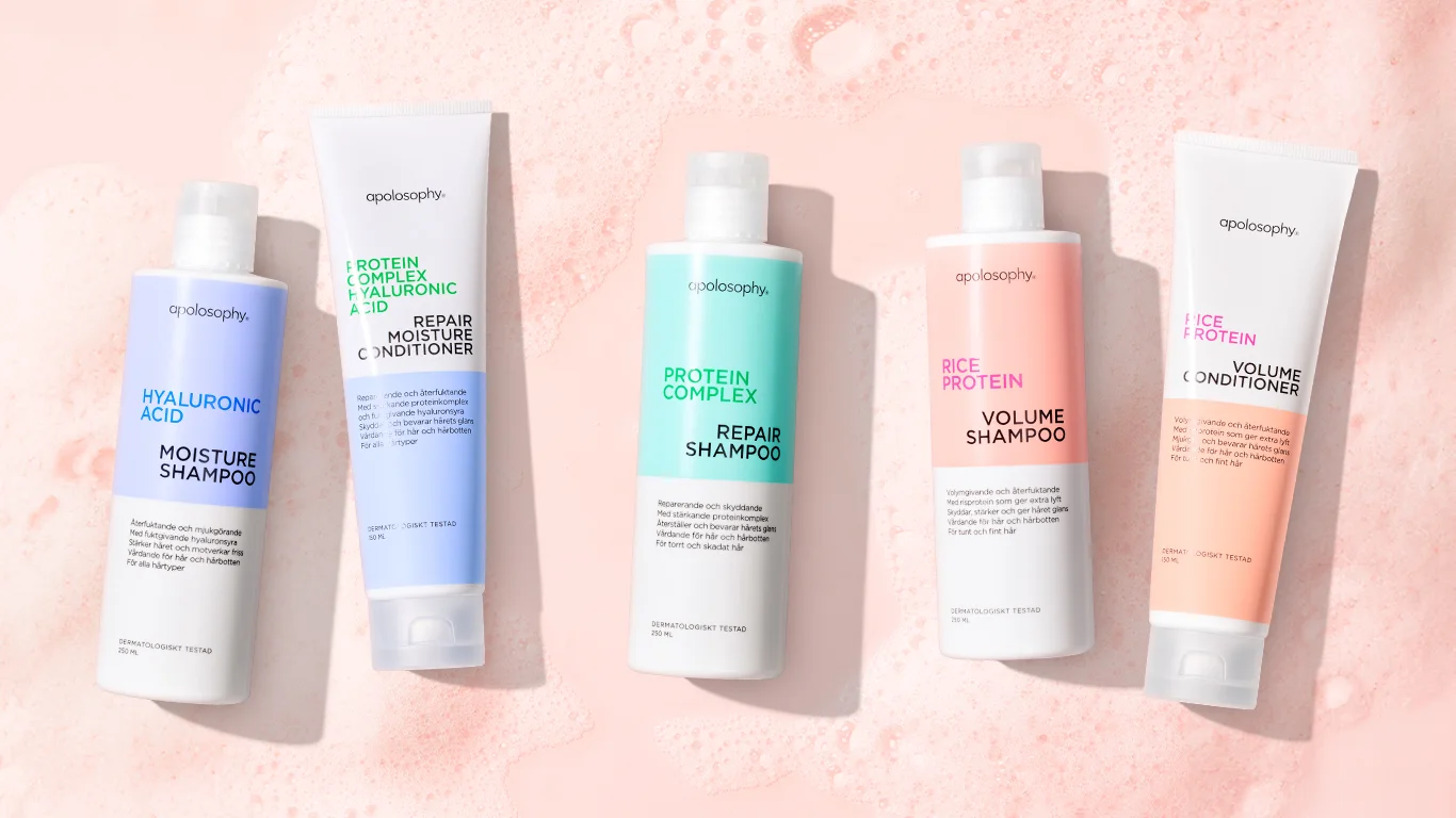 Apolosophy Hair schampo och balsam, 5 produkter visas mot en rosa bakgrund.